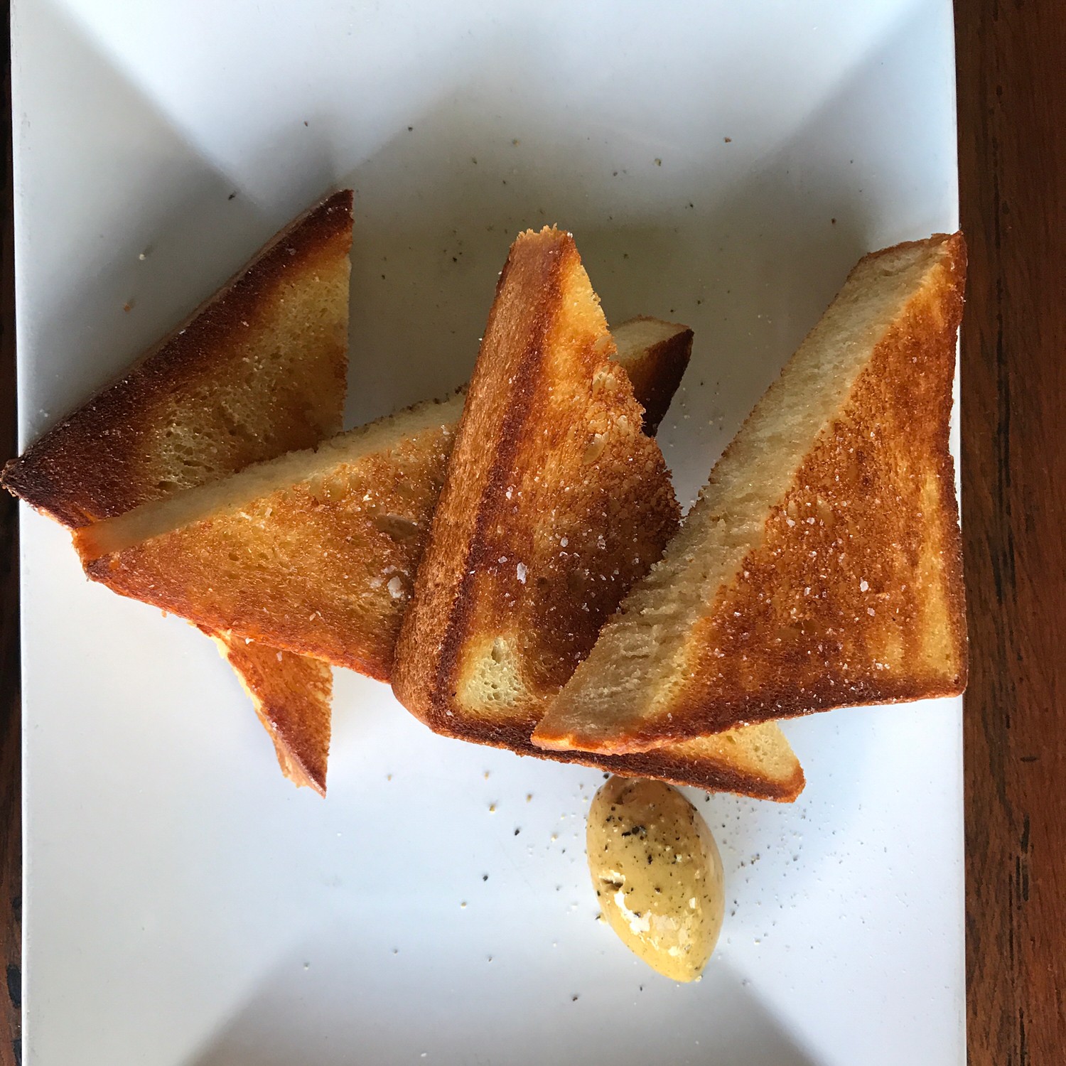 Texas Toast, smoked octopus, beef brisket, beans, homemade root beer