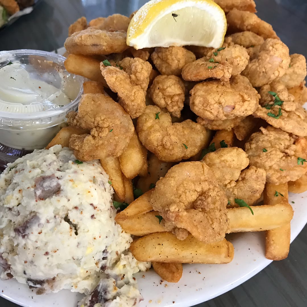 peacemaker - fried shrimp and roast beef Po-Boy sandwich and fried shrimp pla...