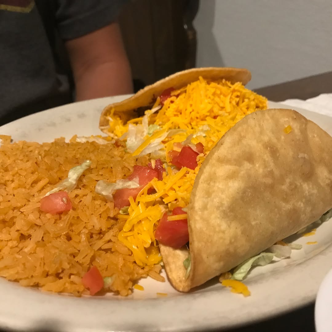 Carnitas and hard shell tacos