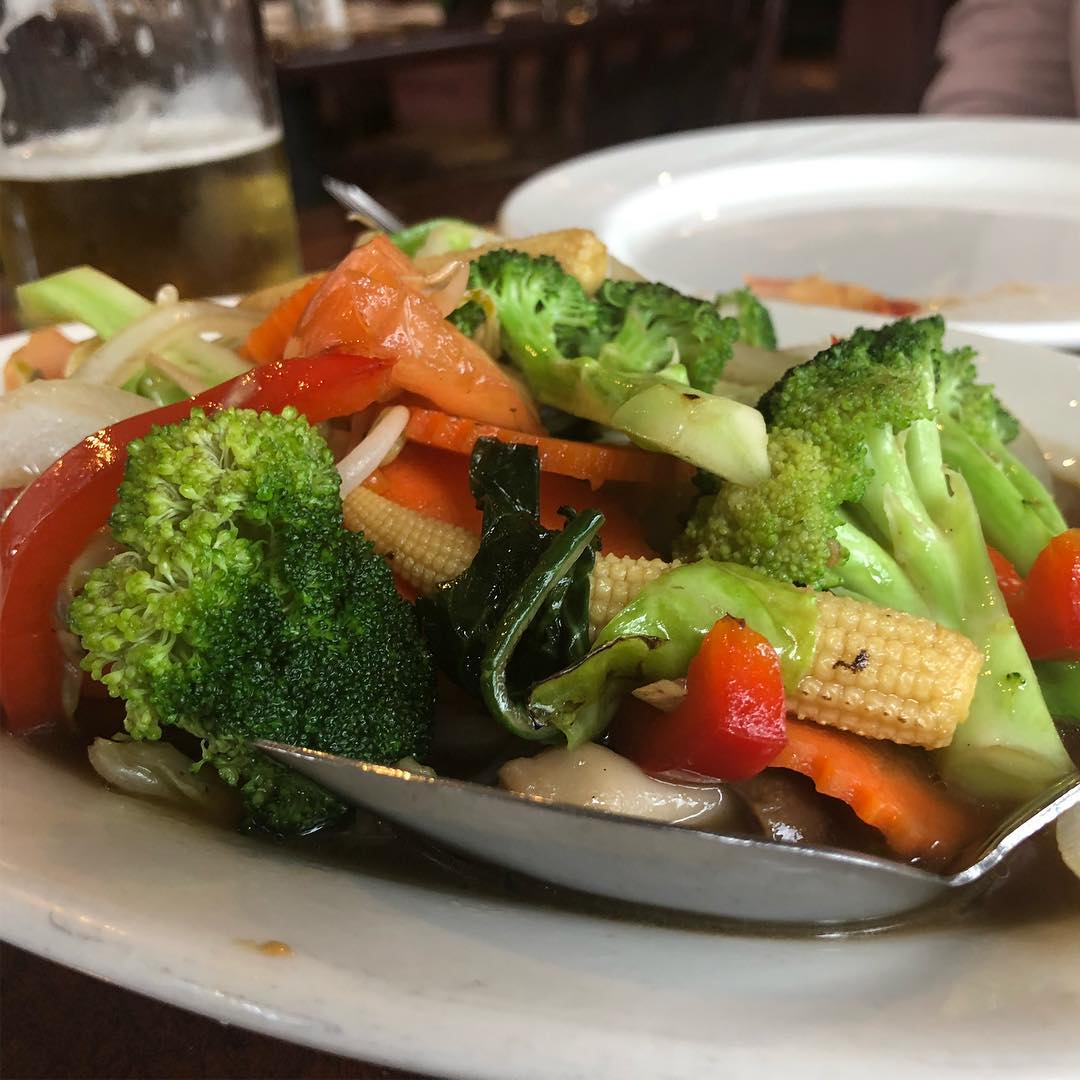 Pad Thai, chicken curry, shrimp rolls, and vegetables at Thai BBQ