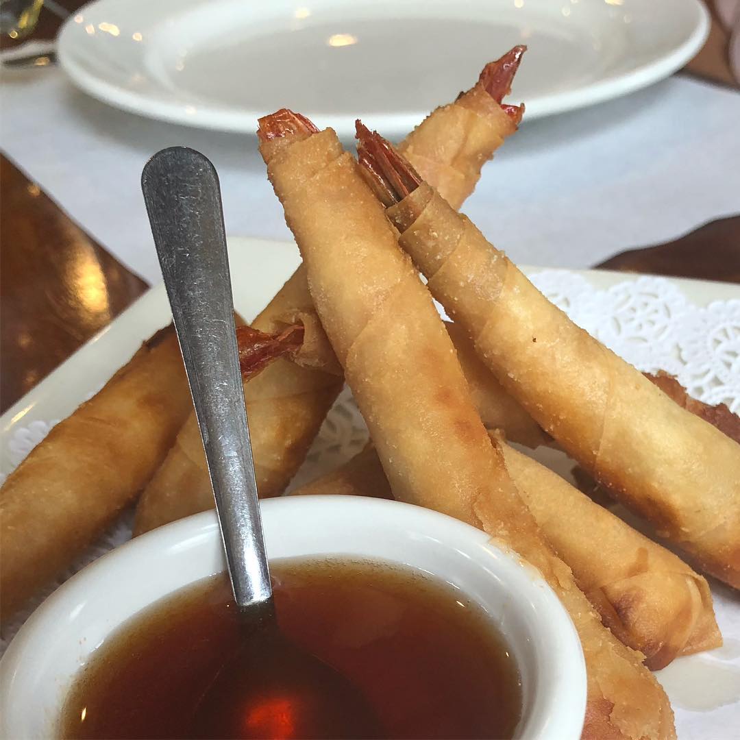 Pad Thai, chicken curry, shrimp rolls, and vegetables at Thai BBQ