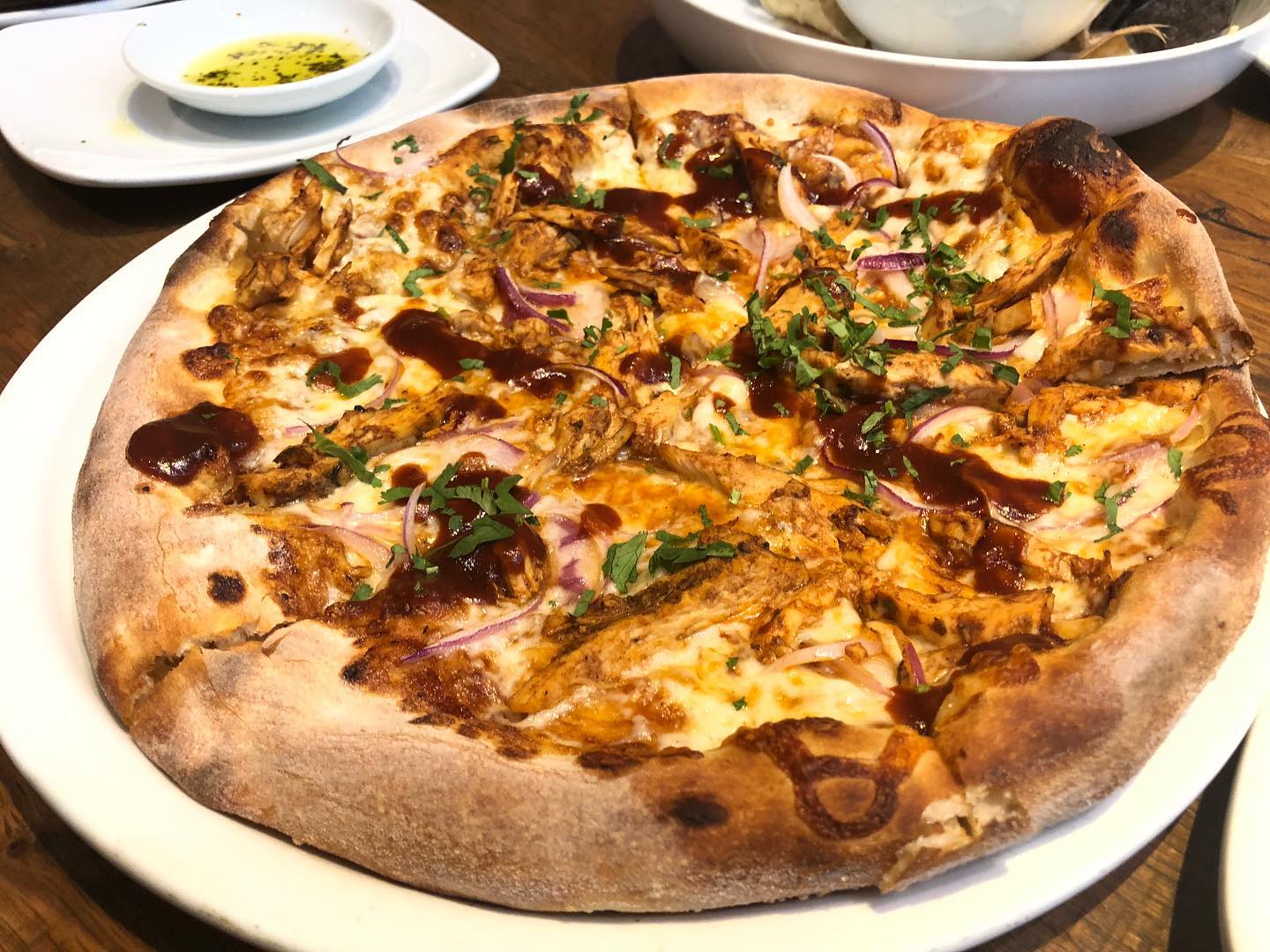 Barbecue chicken pizza and jerk chicken pizza with cauliflower crust at Calif...