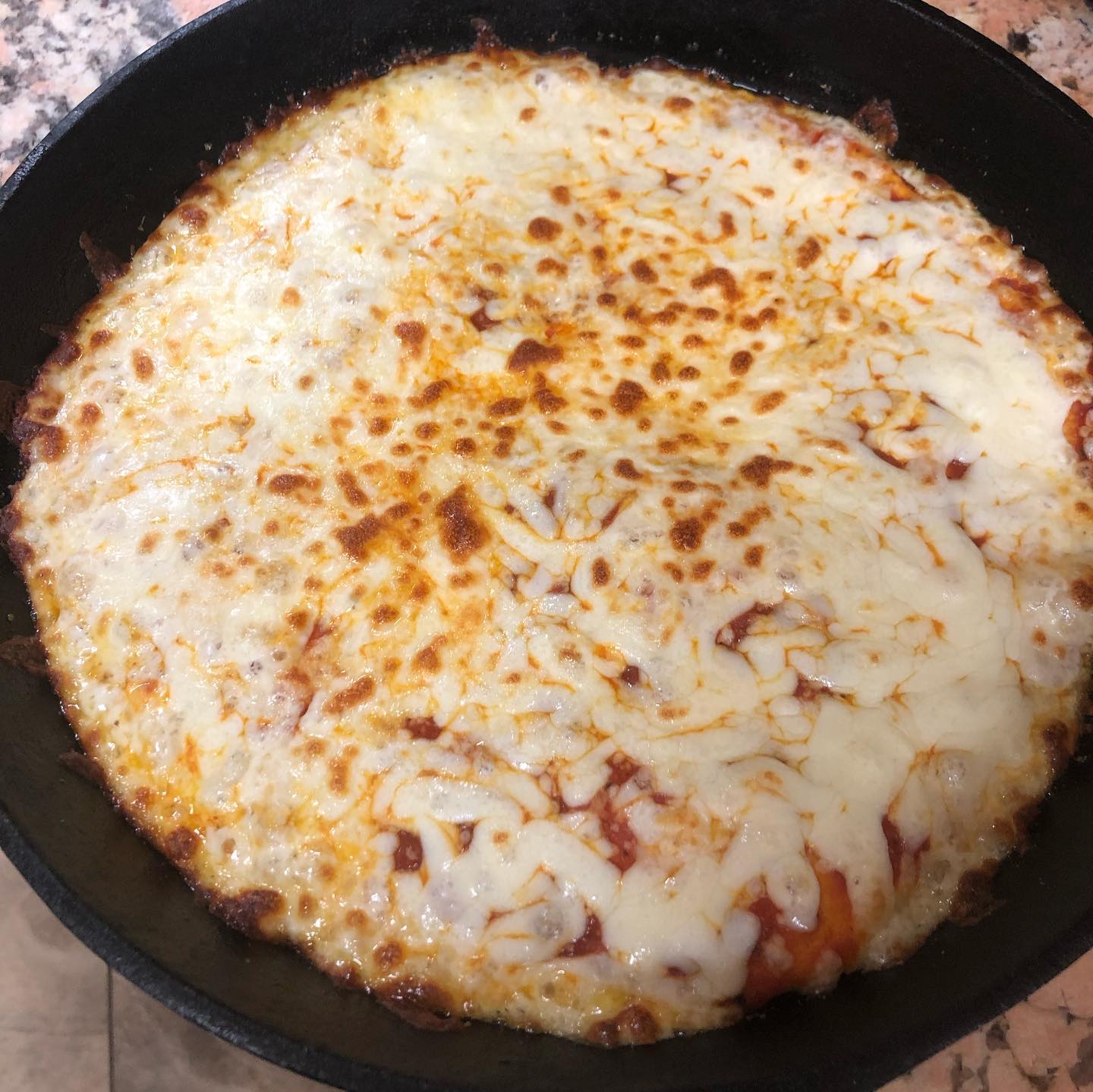 Made a simple cheese pizza in a cast iron pan