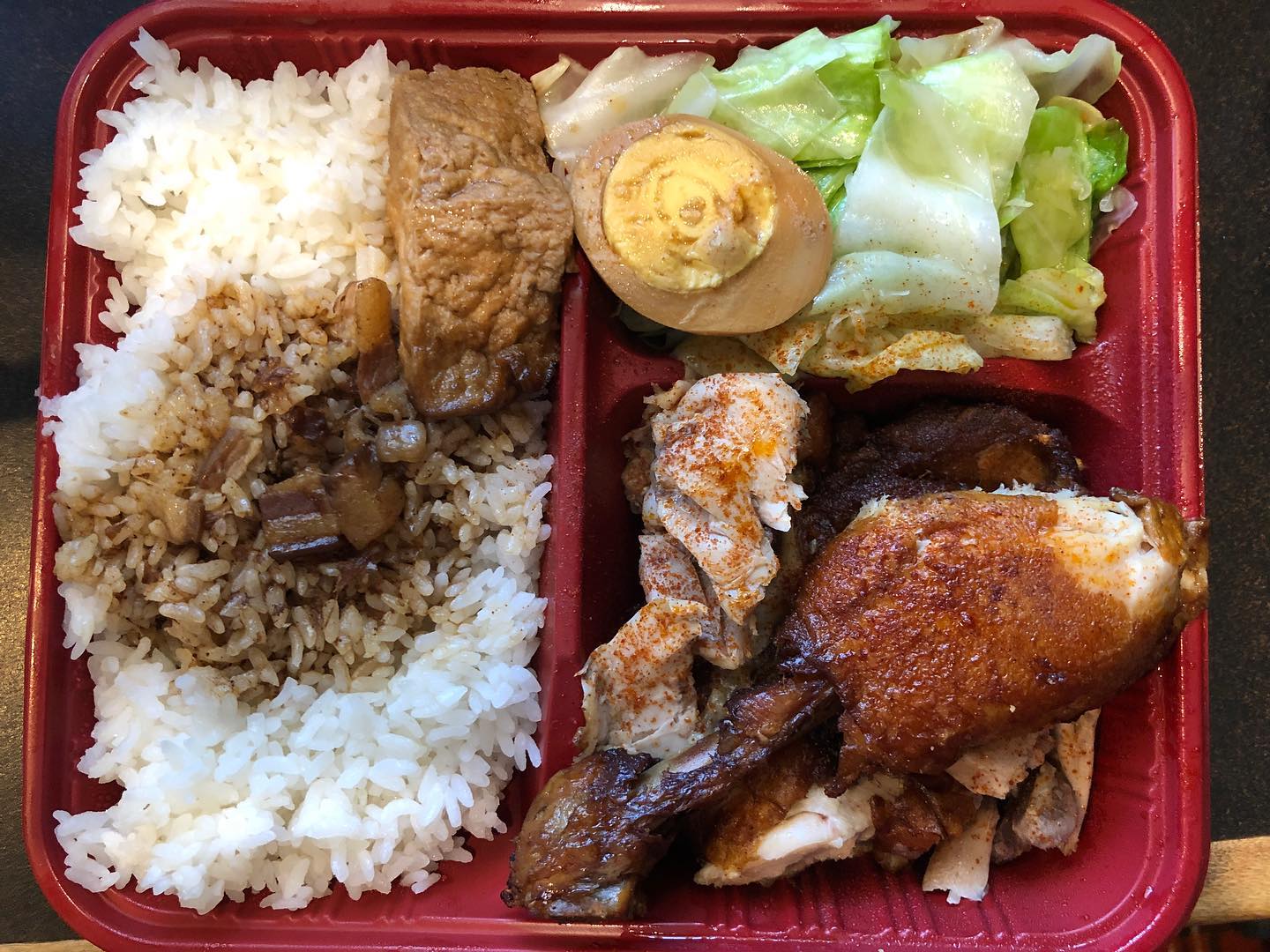 Braised pork over rice and fried chicken leg over rice