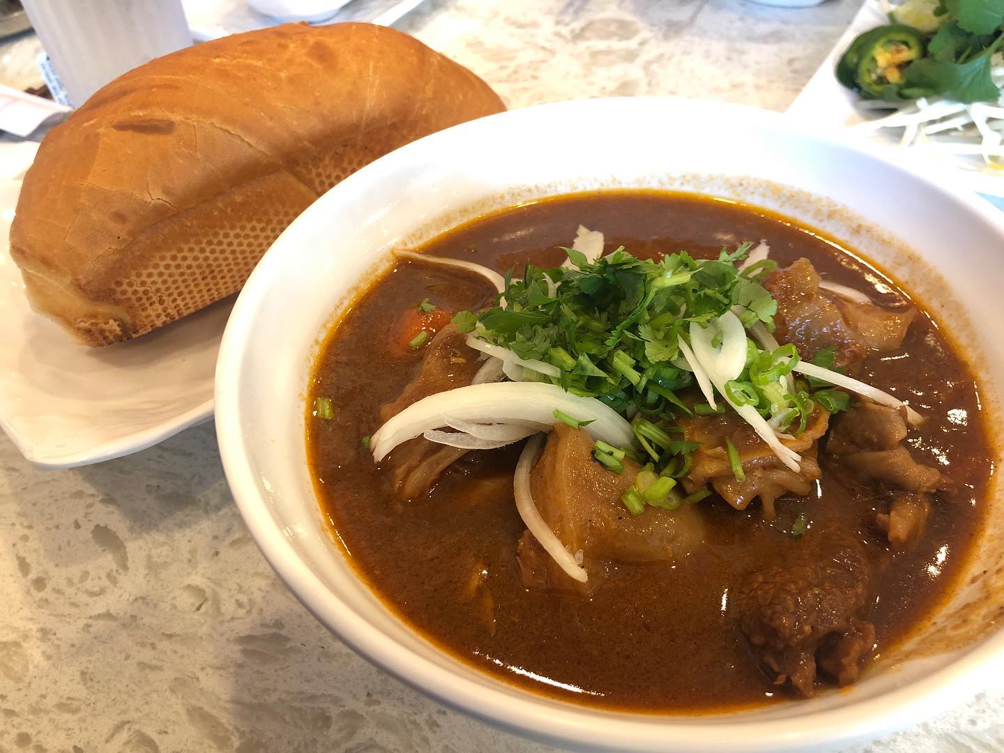 Bo Kho - beef stew with bread and Pho with rare steak