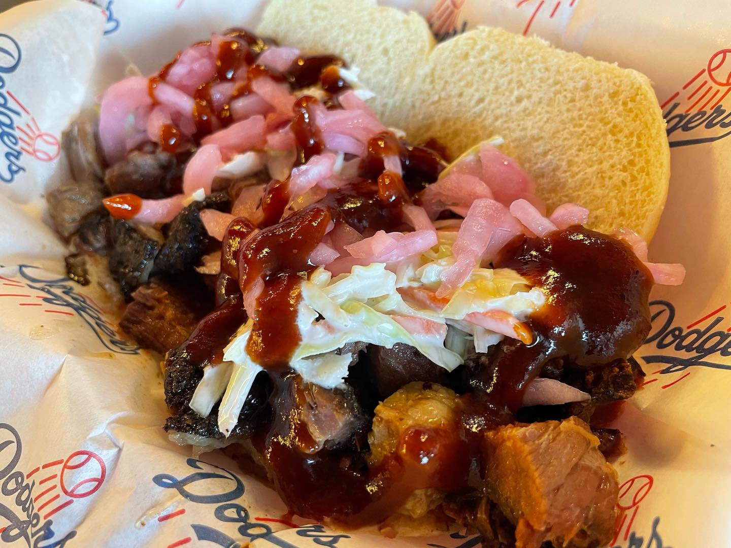 Pulled pork and smoked burnt ends with Kings Hawaiian bread rolls at a Dodger...