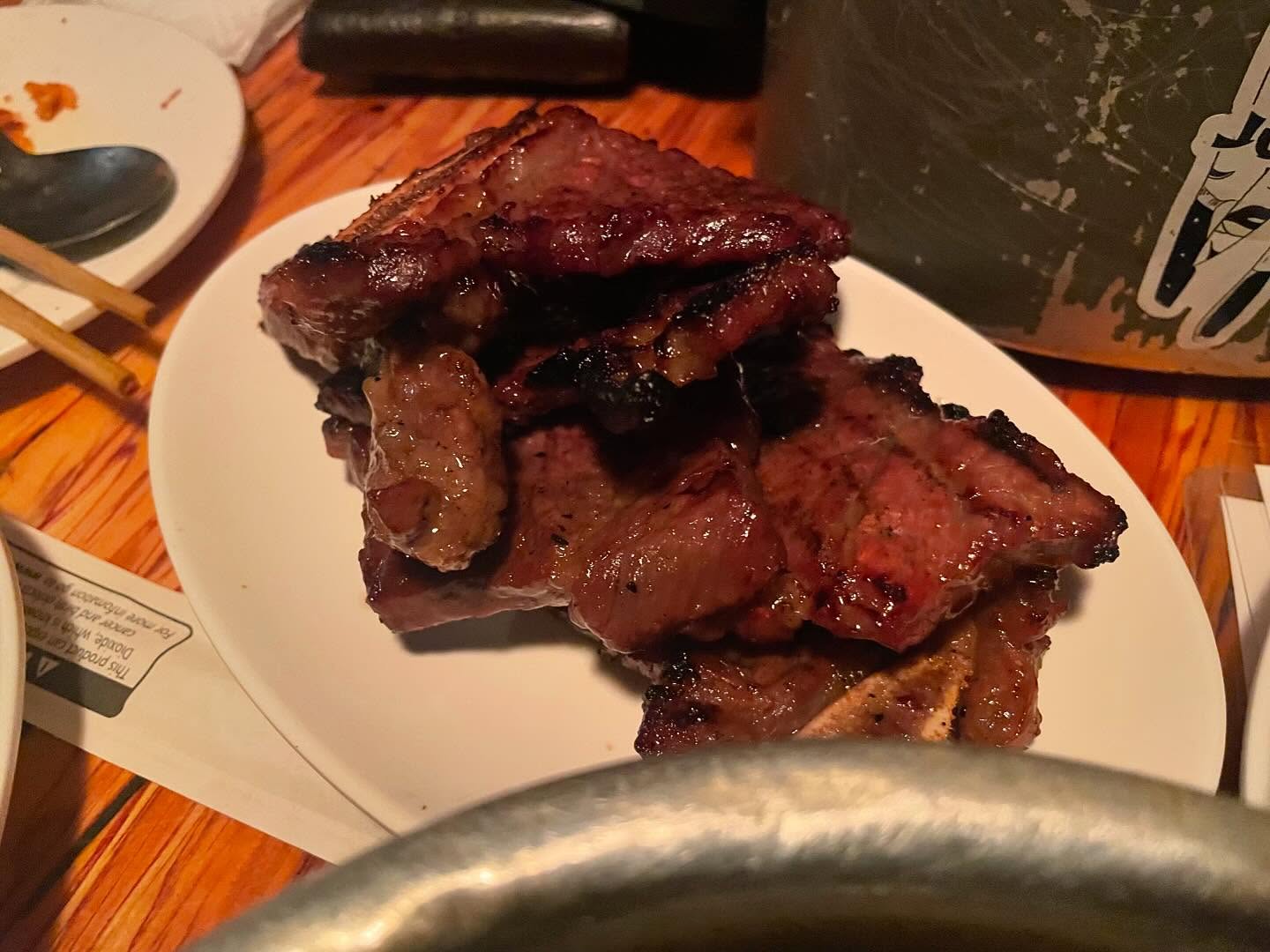 Kimchi pancake, rice box, and skewers at Dan Sung Sa