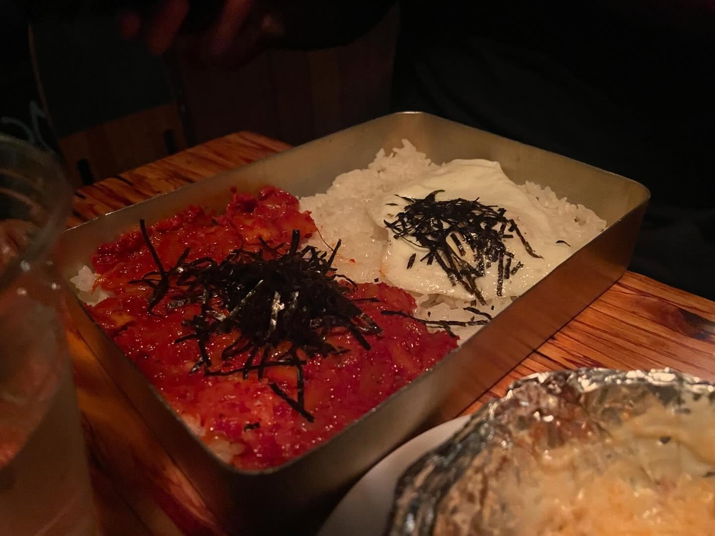 Kimchi pancake, rice box, and skewers at Dan Sung Sa