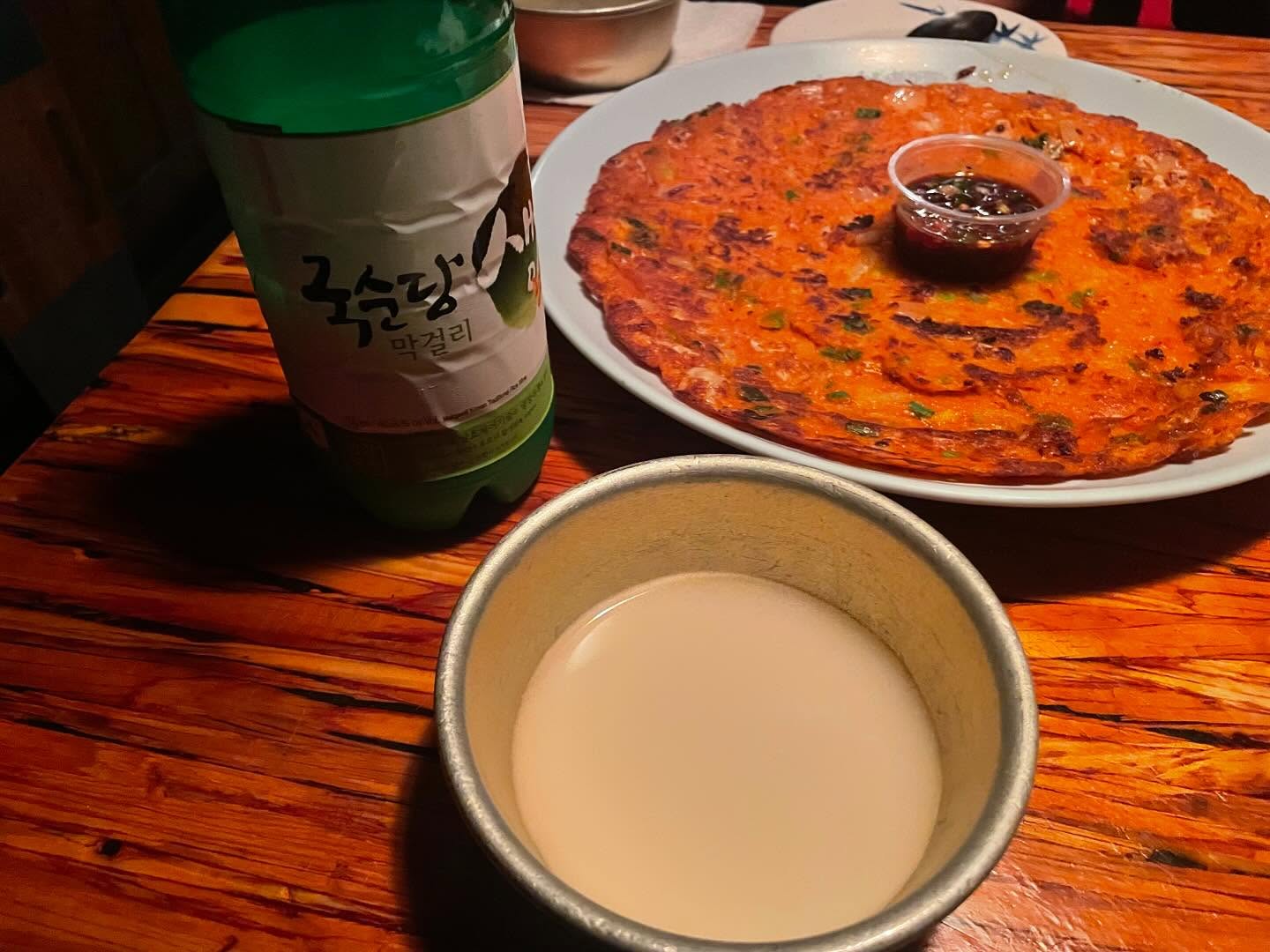 Kimchi pancake, rice box, and skewers at Dan Sung Sa