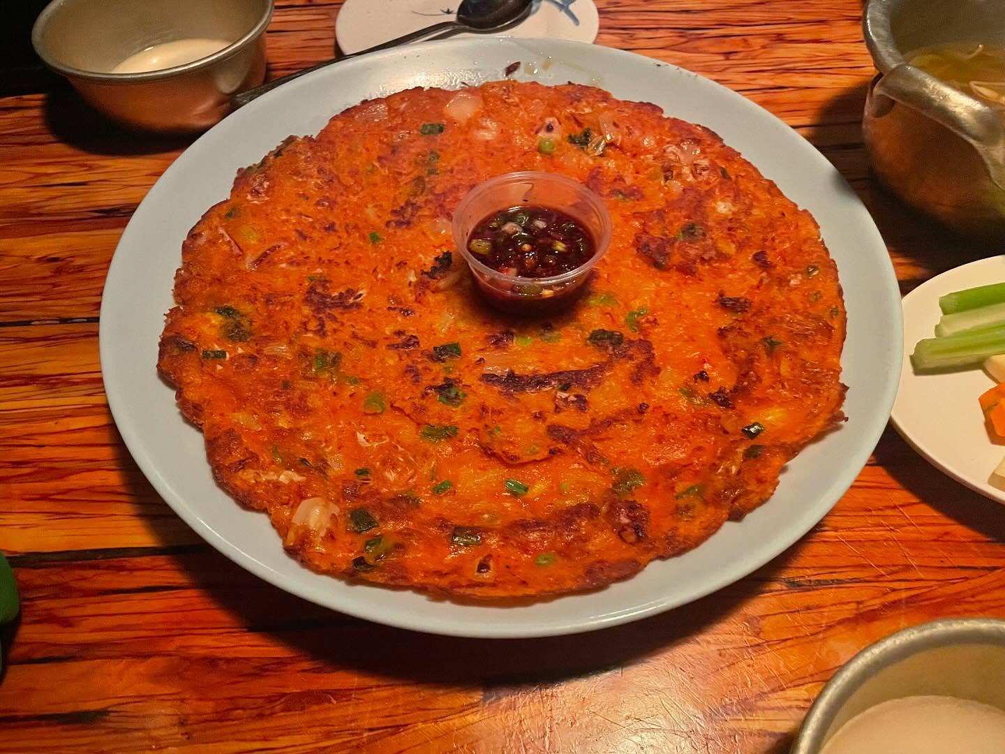 Kimchi pancake, rice box, and skewers at Dan Sung Sa