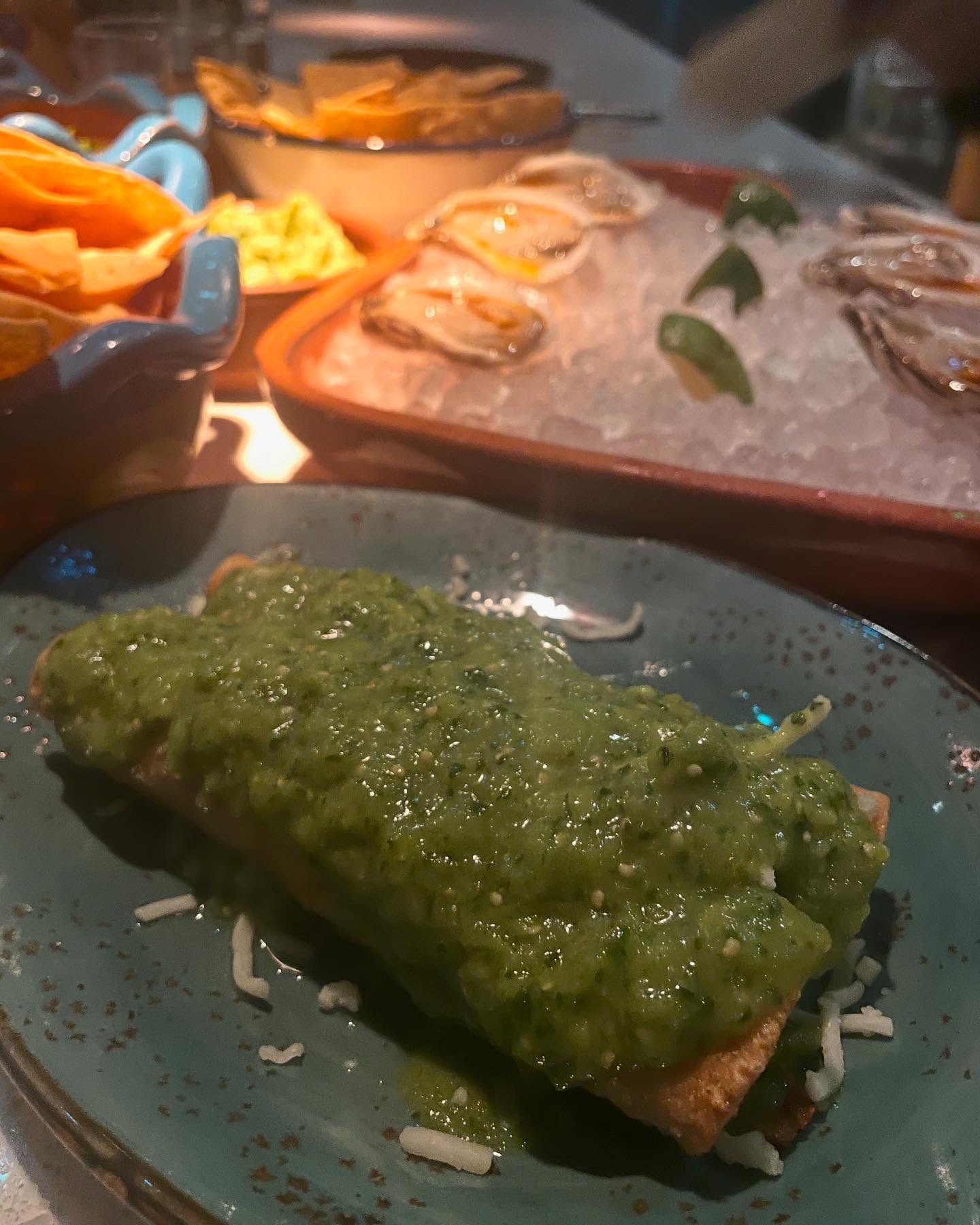 Guerrilla Tacos with carne asada taco and potato and cheese taquito