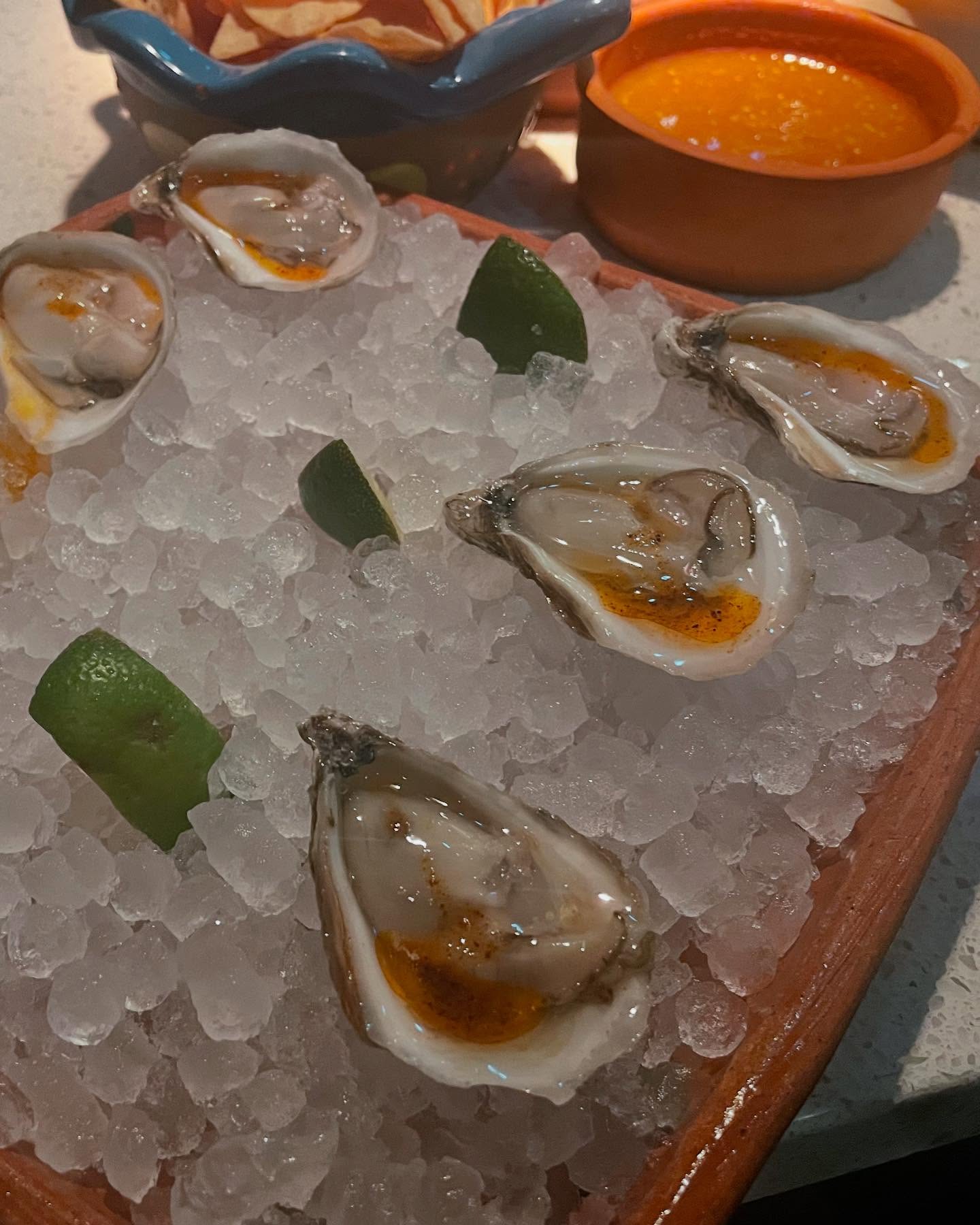 Guerrilla Tacos with carne asada taco and potato and cheese taquito