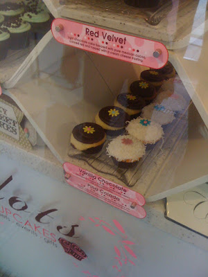 lets finger a taste of the frosting at Dots Cupcakes